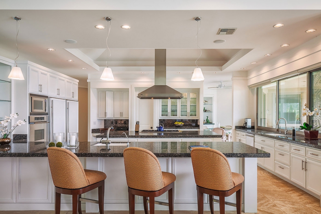 We get ornery about decluttering a space.  Spartan counters look best in photos.