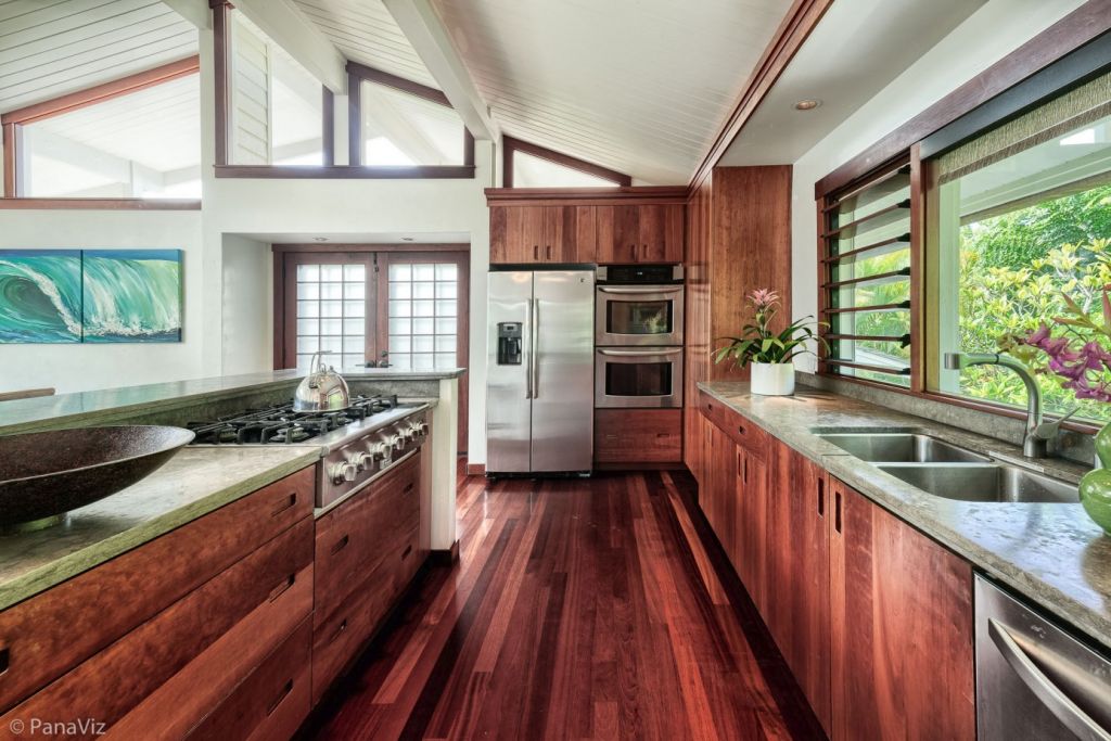 A narrow/long and elegant kitchen