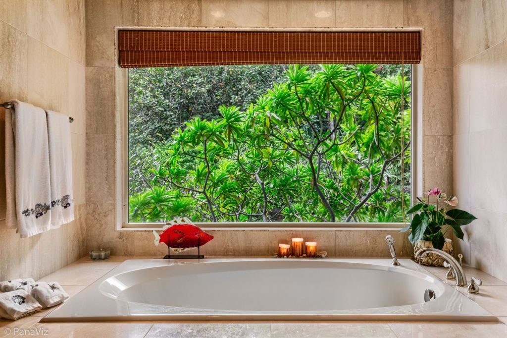 A bath with a jungle view